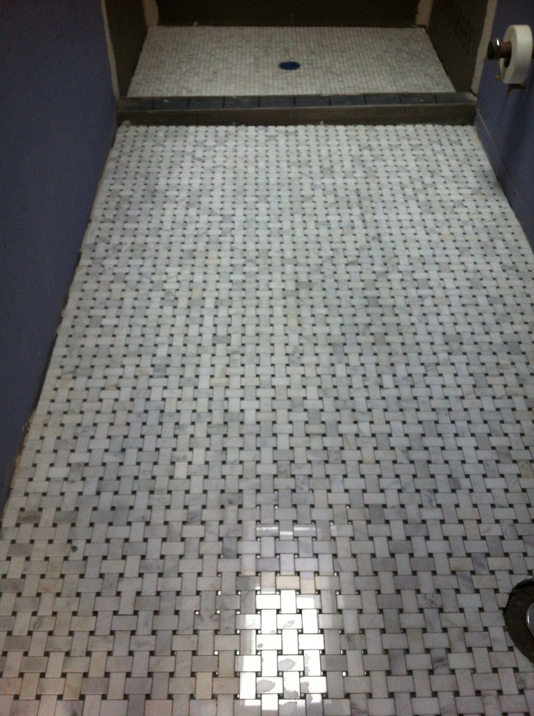 Basketweave tile for main floor and 3/4 by 3/4 tile shower floor.